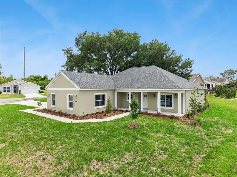 Front exterior of a new home in , Umatilla, FL, highlighting curb appeal (Image 2). Front exterior of a new home in , Umatilla, FL, highlighting curb appeal (Image 2).