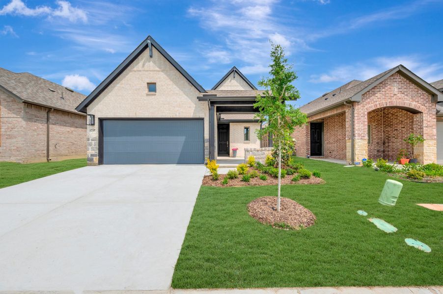 Front exterior of a new home in Creekshaw – Gardens, Royse City, TX, highlighting curb appeal (Image 1). Front exterior of a new home in Creekshaw – Gardens, Royse City, TX, highlighting curb appeal (Image 1).