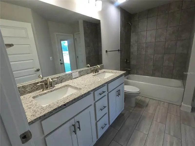 Furnished interior view inside a new home in Hill Country Estates, Dade City (Image 4).