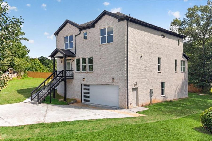 Front exterior of a new home in , Loganville, GA, highlighting curb appeal (Image 23). Front exterior of a new home in , Loganville, GA, highlighting curb appeal (Image 23).