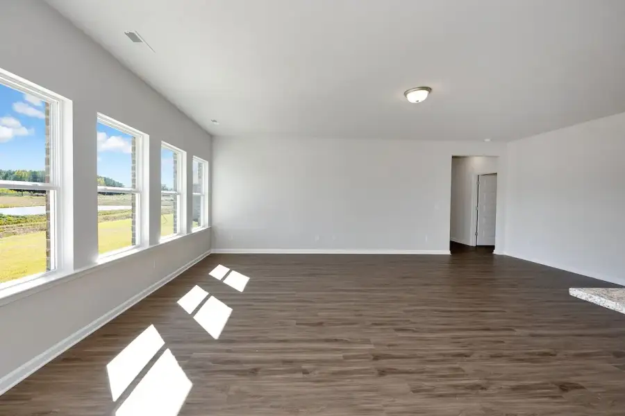 The Avery- Dining Area into Family Room. Sample image for illustration; upgrades, options, and colors may vary.