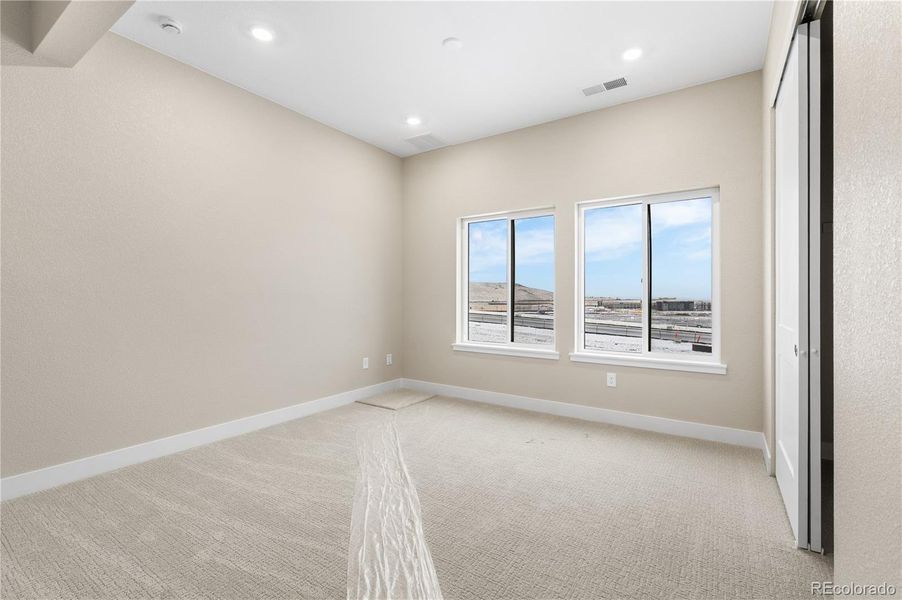 Spacious, unfurnished interior of a new home in Autograph at Lyric, Lone Tree (Image 23).