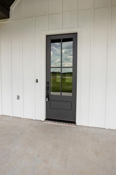 Doorway to property featuring a patio area Doorway to property featuring a patio area