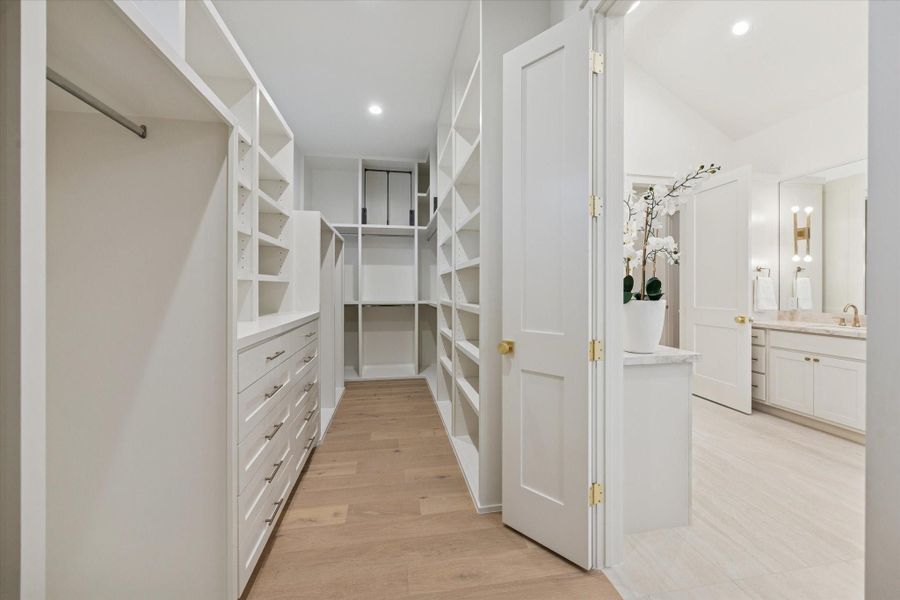 One of the two walk-in closets with custom built-ins.