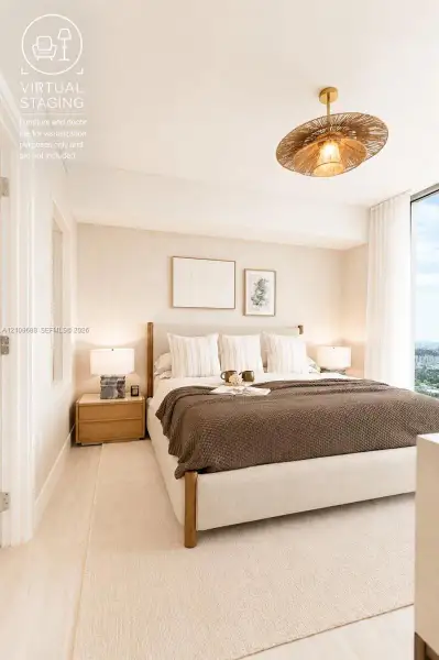 Room featuring expansive floor-to-ceiling windows, light-toned wood-finish flooring, and a textured woven drum pendant light