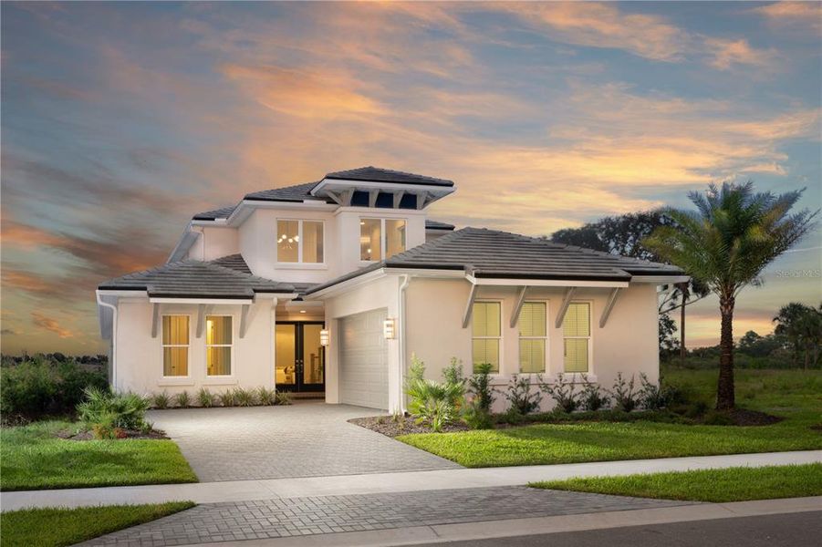 Previously built Veranda model home. NOTE: This pre-construction home will have a shingle roof; buyer may elect to upgrade to tile roof as shown.