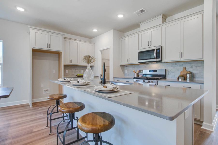 Representative furnished interior of a home built from the Harrison by Ashton Woods in Watson Hill, Summerville (Image 15).