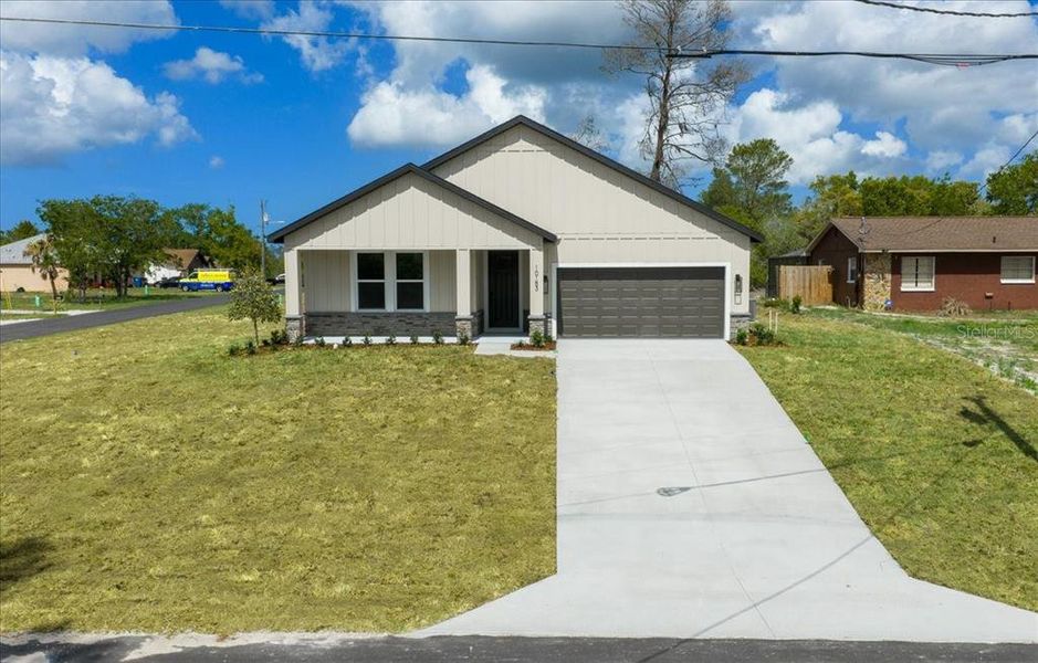 Front exterior of a new home in , Spring Hill, FL, highlighting curb appeal (Image 26).