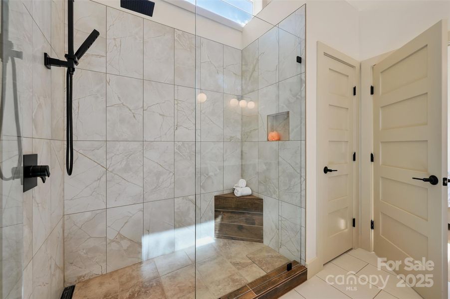 large shower and linen closet