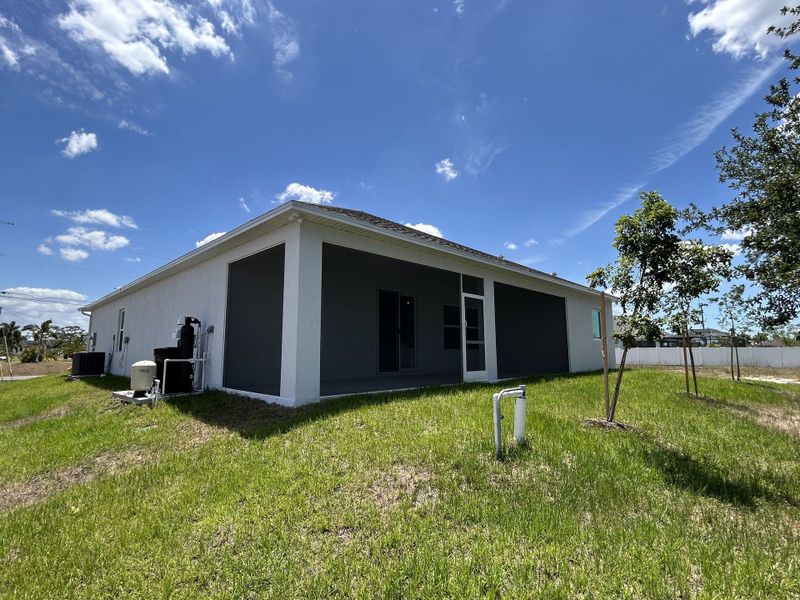 Front exterior of a new home in Burnt Store, Cape Coral, FL, highlighting curb appeal (Image 2). Front exterior of a new home in Burnt Store, Cape Coral, FL, highlighting curb appeal (Image 2).