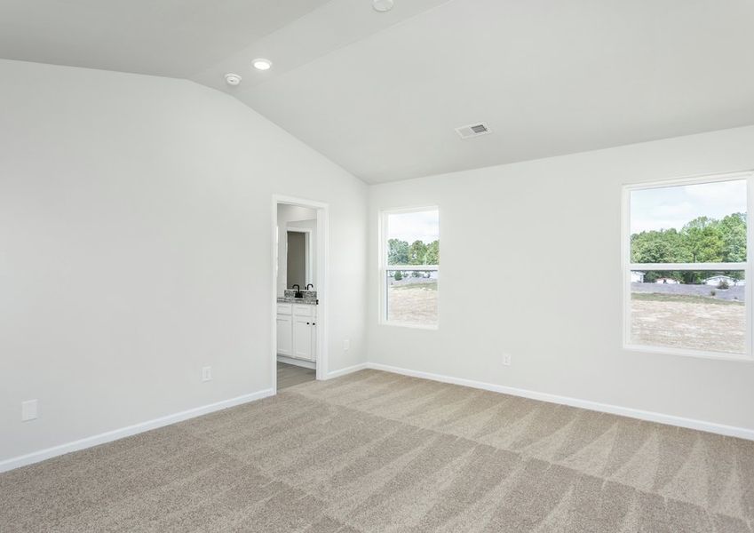 The master bedroom has cathedral ceilings.