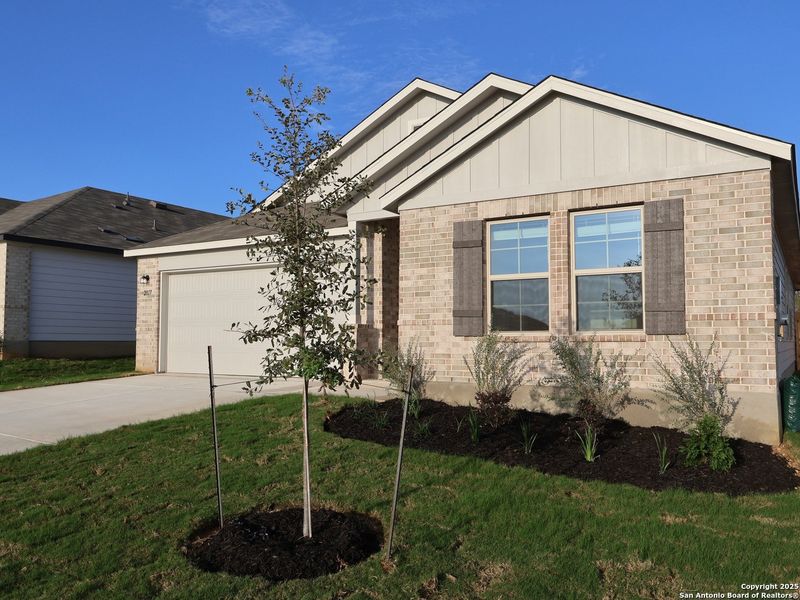 Front exterior of a new home in Greenspoint Heights, Seguin, TX, highlighting curb appeal (Image 2).