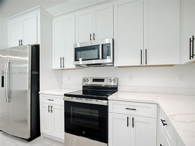 Furnished interior view inside a new home in , Port Charlotte (Image 8).
