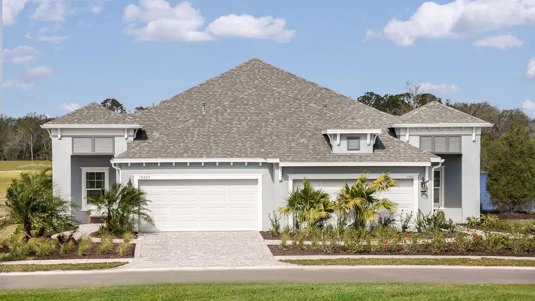 Front exterior of a new home in Wildleaf at North River Ranch, Parrish, FL, highlighting curb appeal (Image 18). Front exterior of a new home in Wildleaf at North River Ranch, Parrish, FL, highlighting curb appeal (Image 18).
