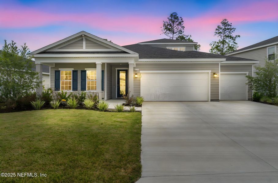 Front exterior of a new home in Seminole Palms Single-Family Homes, Palm Coast, FL, highlighting curb appeal (Image 23).