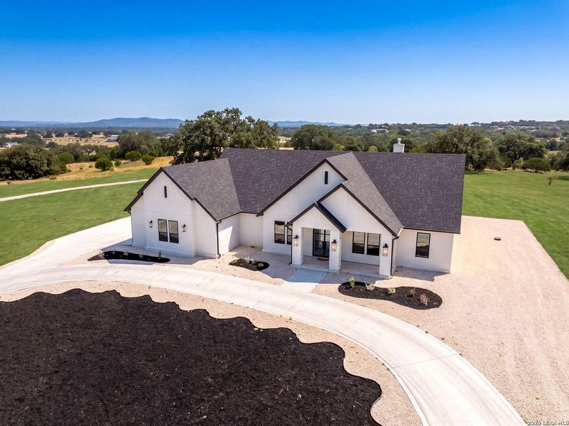 Front exterior of a new home in , Bandera, TX, highlighting curb appeal (Image 30). Front exterior of a new home in , Bandera, TX, highlighting curb appeal (Image 30).