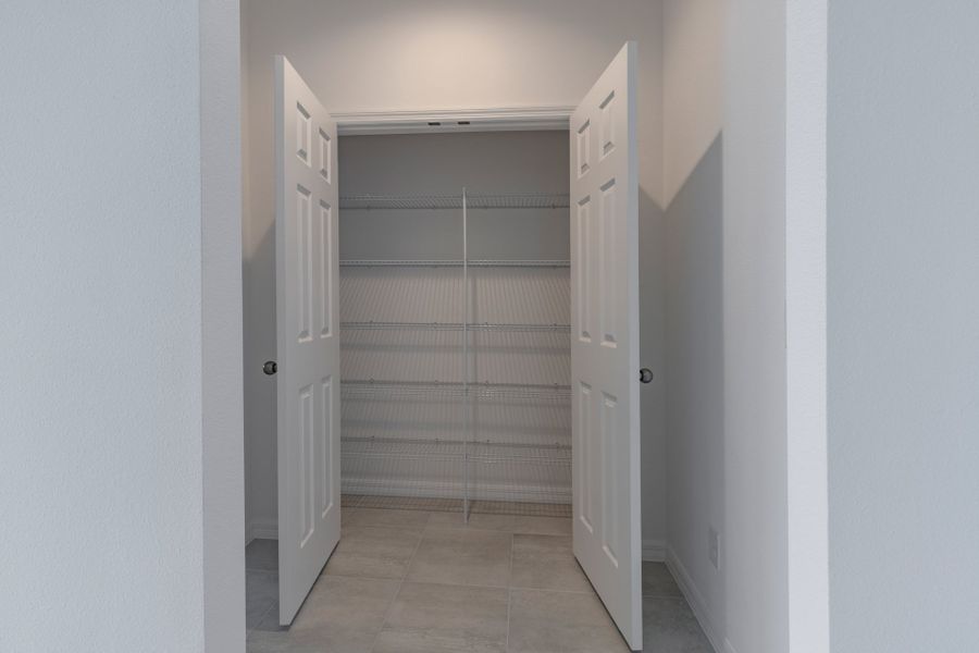 Representative unfurnished interior of a home built from the Sullivan by Trinity Family Builders in Taylor Ridge, Deland (Image 34).