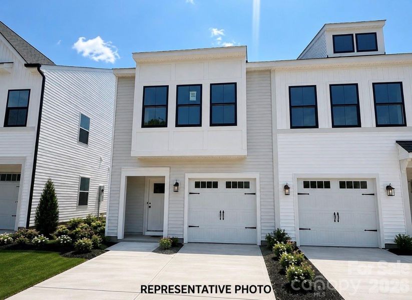 Front exterior of a new home in Ryder Park, Charlotte, NC, highlighting curb appeal (Image 13). Front exterior of a new home in Ryder Park, Charlotte, NC, highlighting curb appeal (Image 13).