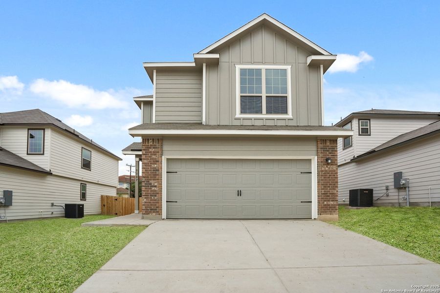 Front exterior of a new home in Somerset Trails, San Antonio, TX, highlighting curb appeal (Image 2). Front exterior of a new home in Somerset Trails, San Antonio, TX, highlighting curb appeal (Image 2).