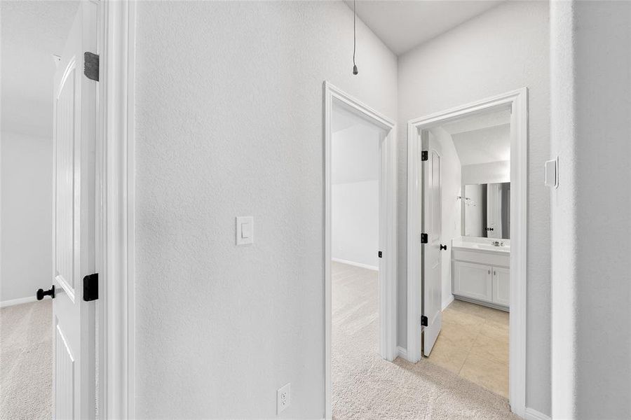 Hallway between two upstairs guest rooms