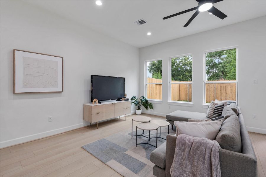 Bright living room with minimalist design and wall-to-wall windows. Bright living room with minimalist design and wall-to-wall windows.
