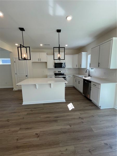 Furnished interior view inside a new home in Springwood Grove, Central (Image 3).