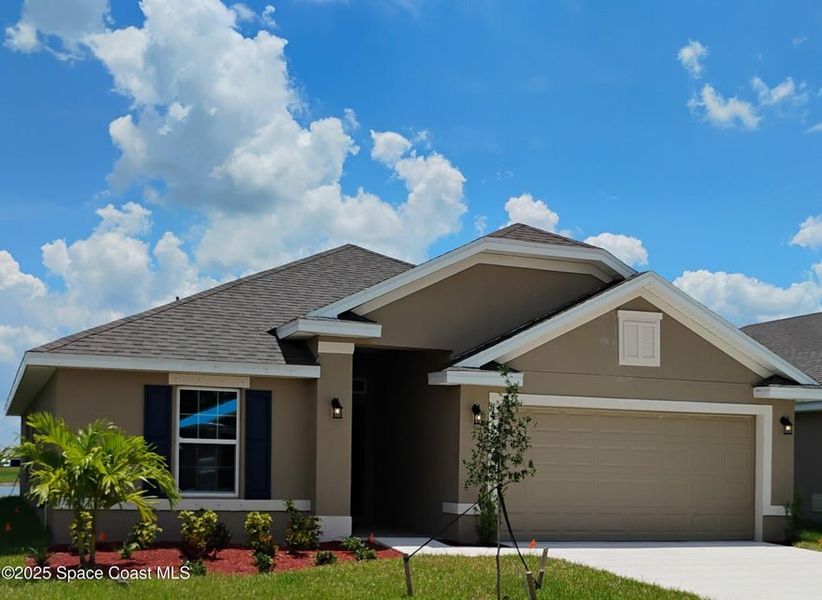 Front exterior of a new home in St. John Preserve, Palm Bay, FL, highlighting curb appeal (Image 1). Front exterior of a new home in St. John Preserve, Palm Bay, FL, highlighting curb appeal (Image 1).
