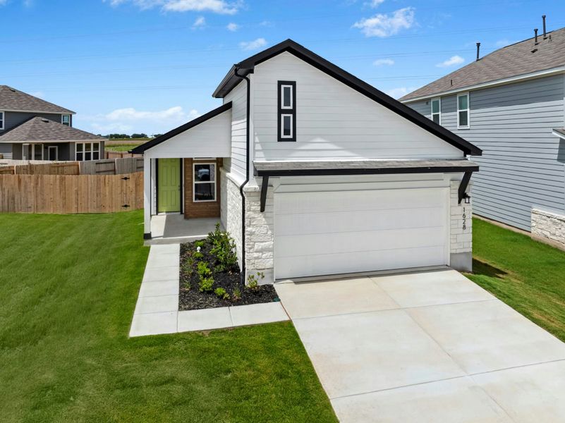Front exterior of a new home in Willowbrook, New Braunfels, TX, highlighting curb appeal (Image 17). Front exterior of a new home in Willowbrook, New Braunfels, TX, highlighting curb appeal (Image 17).