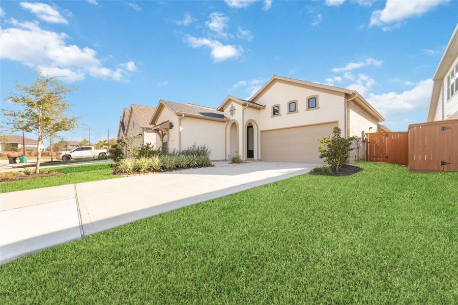 Front exterior of a new home in Elyson 45' & 70', Katy, TX, highlighting curb appeal (Image 2). Front exterior of a new home in Elyson 45' & 70', Katy, TX, highlighting curb appeal (Image 2).