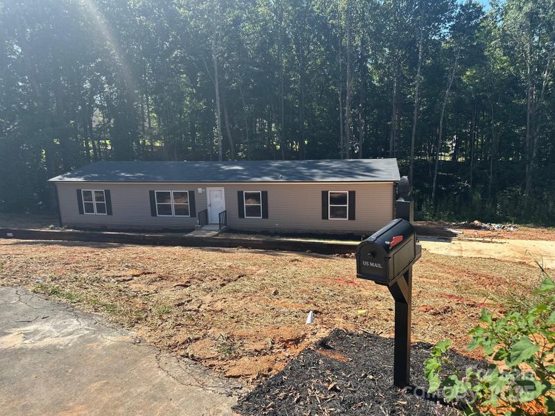 Front exterior of a new home in , Mooresville, NC, highlighting curb appeal (Image 2). Front exterior of a new home in , Mooresville, NC, highlighting curb appeal (Image 2).