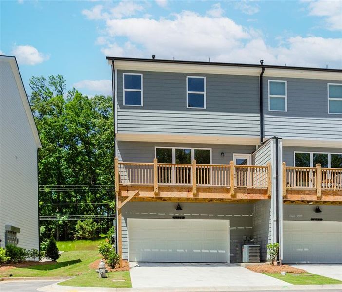 Front exterior of a new home in Hillcrest Landing, Sugar Hill, GA, highlighting curb appeal (Image 28). Front exterior of a new home in Hillcrest Landing, Sugar Hill, GA, highlighting curb appeal (Image 28).