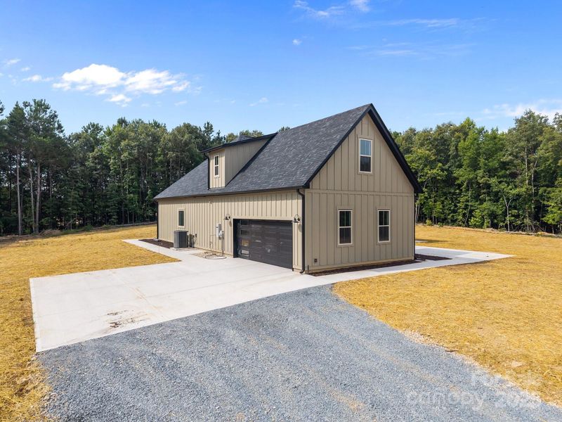 Front exterior of a new home in , Peachland, NC, highlighting curb appeal (Image 25). Front exterior of a new home in , Peachland, NC, highlighting curb appeal (Image 25).