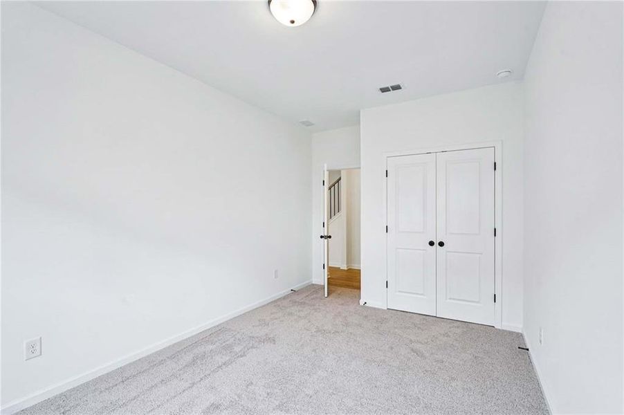 Spacious, unfurnished interior of a new home in Eastlyn Crossing, Flowery Branch (Image 20).