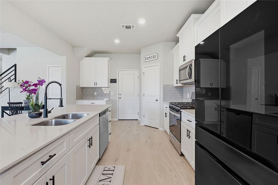 Furnished interior view inside a new home in Crosswinds, Kyle (Image 25).
