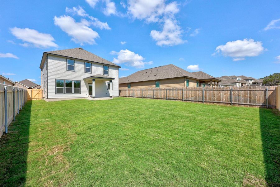 Front exterior of a new home in Retreat at San Gabriel, Georgetown, TX, highlighting curb appeal (Image 2). Front exterior of a new home in Retreat at San Gabriel, Georgetown, TX, highlighting curb appeal (Image 2).