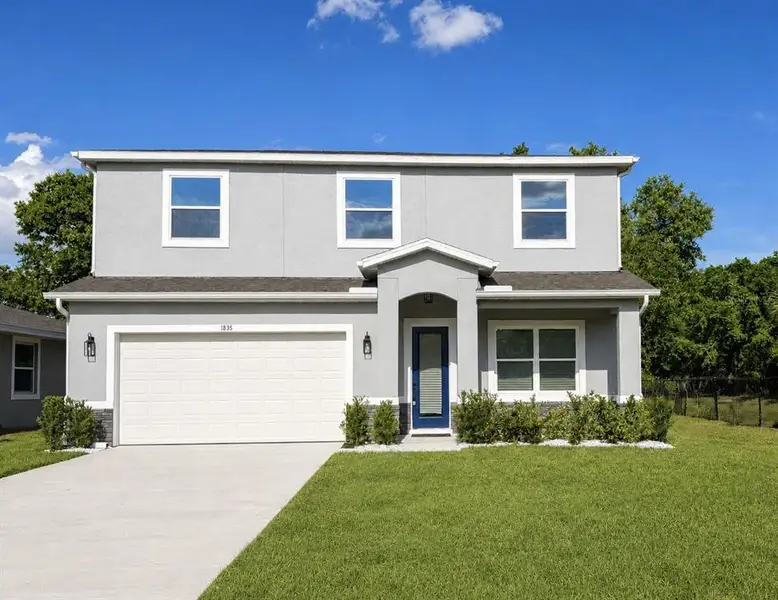 Front exterior of a new home in , Sanford, FL, highlighting curb appeal (Image 1). Front exterior of a new home in , Sanford, FL, highlighting curb appeal (Image 1).