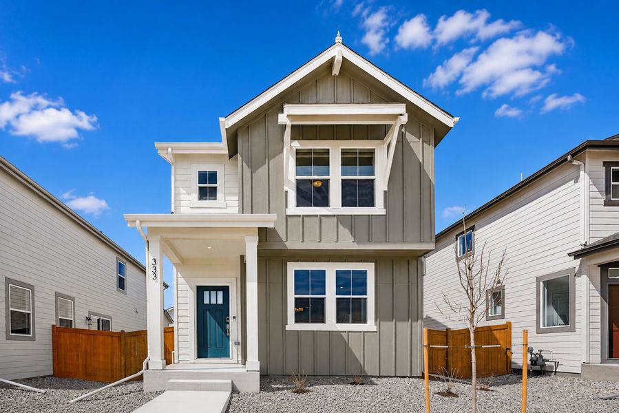 Front exterior of a new home in Sky Ranch, Watkins, CO, highlighting curb appeal (Image 1). Front exterior of a new home in Sky Ranch, Watkins, CO, highlighting curb appeal (Image 1).