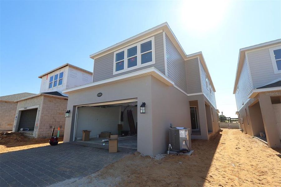 In-progress construction of a new home in Lake Star at Ovation, Winter Garden, FL (Image 16).