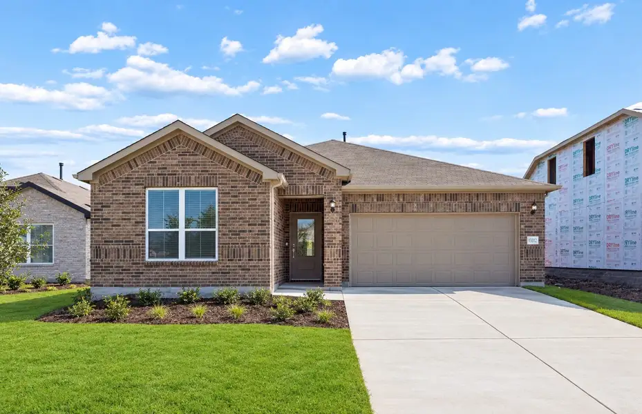 Front exterior of a new home in Lagos, Manor, TX, highlighting curb appeal (Image 18).