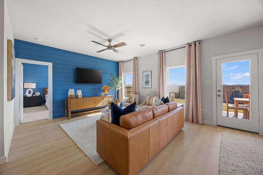 A living room with a large blue wall. A living room with a large blue wall.