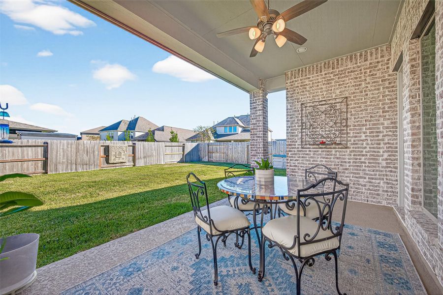 The patio features a convenient gas connection that is readily available for outdoor grilling and entertaining, making it the perfect setup for seamless al fresco dining and hosting summer cookouts. (Note: Photo is staged; property is currently vacant.) The patio features a convenient gas connection that is readily available for outdoor grilling and entertaining, making it the perfect setup for seamless al fresco dining and hosting summer cookouts. (Note: Photo is staged; property is currently vacant.)