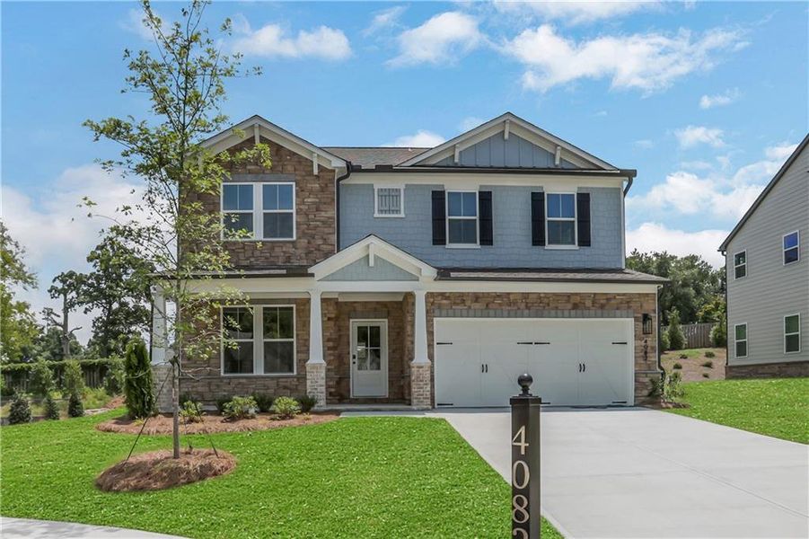 Front exterior of a new home in The Paddocks at Doc Hughes, Buford, GA, highlighting curb appeal (Image 1). Front exterior of a new home in The Paddocks at Doc Hughes, Buford, GA, highlighting curb appeal (Image 1).