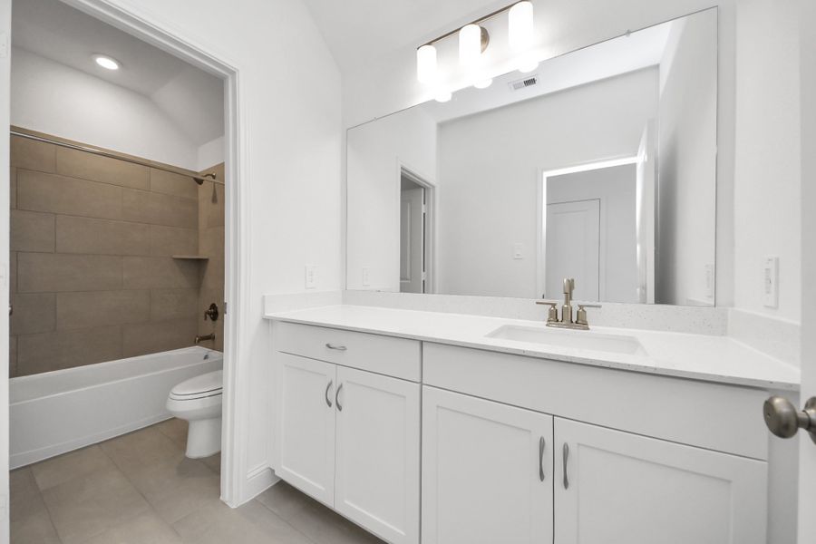 Furnished interior view inside a new home in ARTAVIA, Conroe (Image 13).
