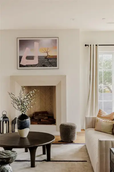 Centered around a modern hearth, this space captures both warmth and sophistication, with views that lead effortlessly outdoors. Centered around a modern hearth, this space captures both warmth and sophistication, with views that lead effortlessly outdoors.