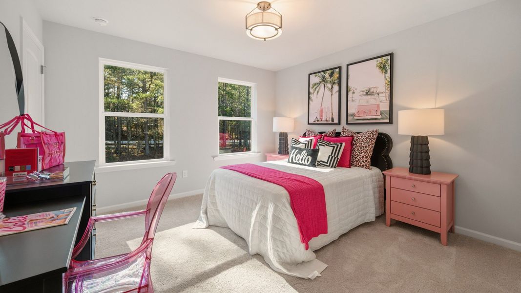 Bedroom with bright natural lighting from windows and carpet Bedroom with bright natural lighting from windows and carpet