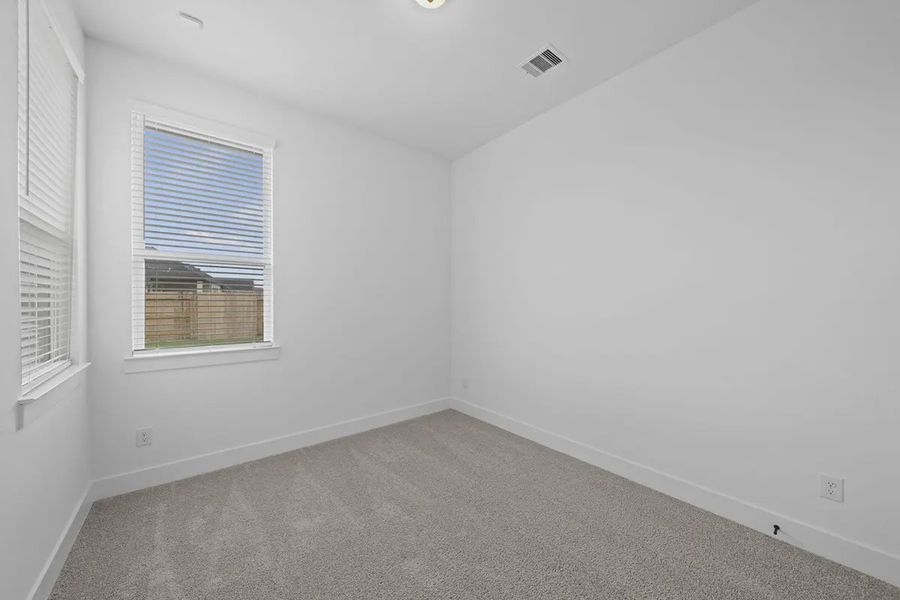 Representative unfurnished interior of a home built from the Summerton by Chesmar Homes in University Heights, Round Rock (Image 26).