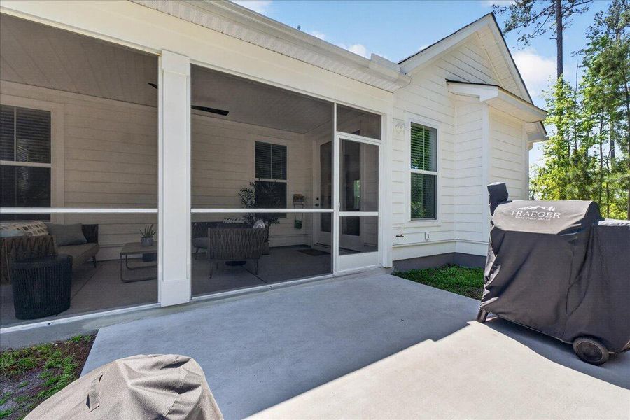 Exterior details and patio area of a home in Tidewater at Lakes of Cane Bay, Summerville (Image 26).