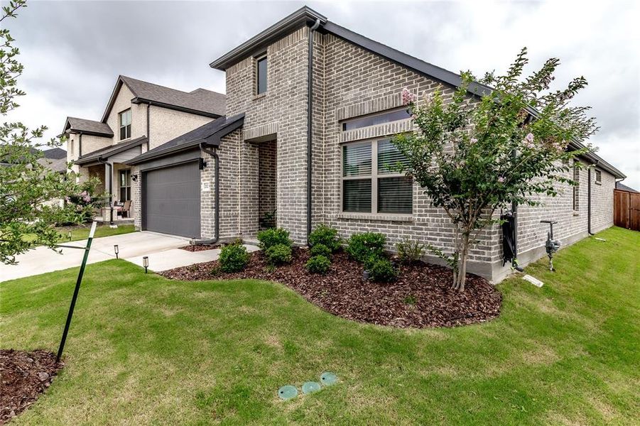 Front exterior of a new home in Devonshire, Forney, TX, highlighting curb appeal (Image 20). Front exterior of a new home in Devonshire, Forney, TX, highlighting curb appeal (Image 20).