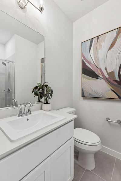 Bathroom in the Oscar home plan by Trophy Signature Homes – REPRESENTATIVE PHOTO