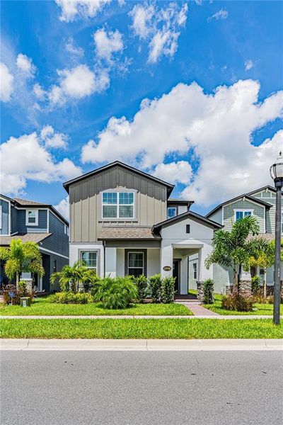 Front exterior of a new home in Encore at Ovation, Winter Garden, FL, highlighting curb appeal (Image 28).